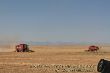 Combines in front of the rockies.jpg